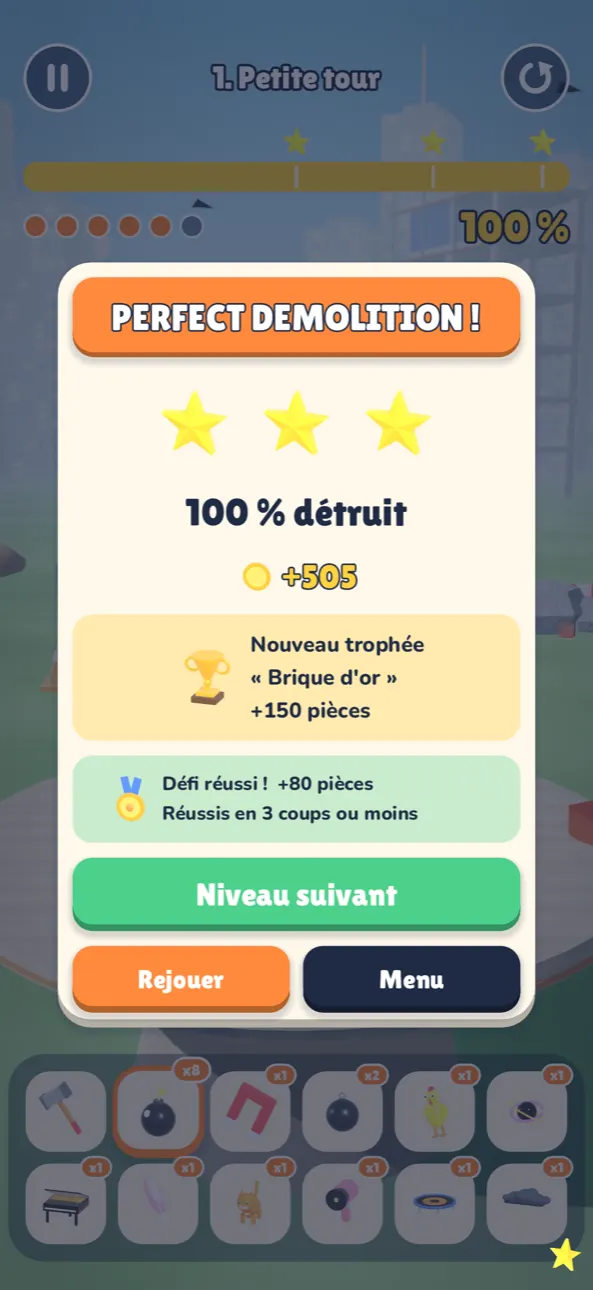 L’écran de résultat « PERFECT DEMOLITION ! » : trois étoiles, 100 % détruit, un nouveau trophée « Brique d’or » et le défi réussi